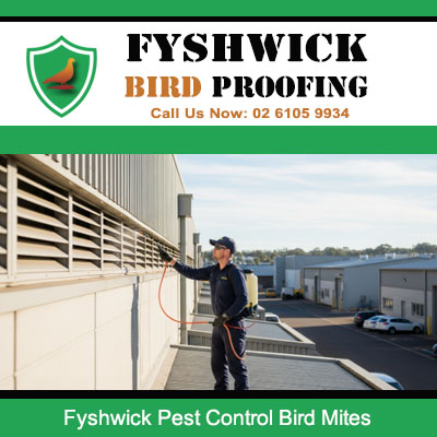 Professional bird mite control specialist working on warehouse exterior at Fyshwick ACT
